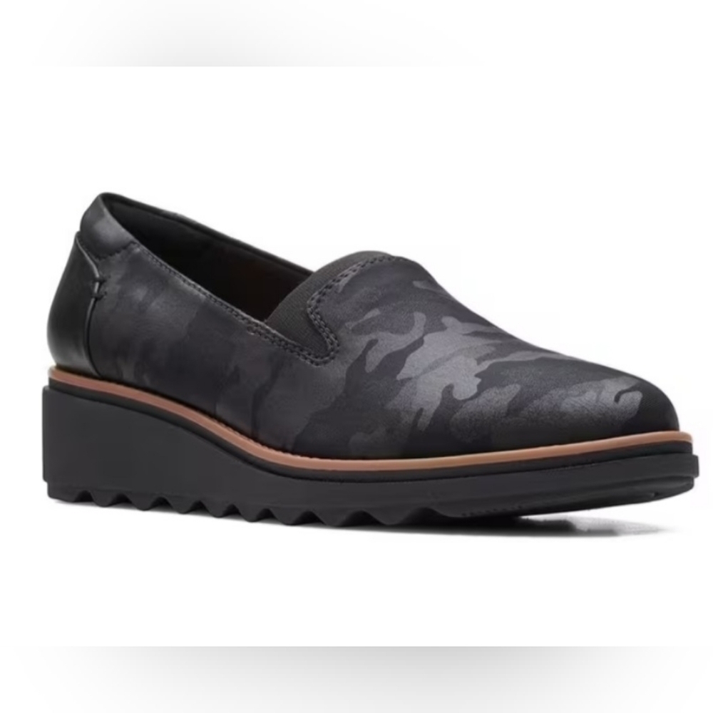 CLARKS SHARON DOLLY FLATS black camo slip-on flat.  Slight wedge.  Size is 10 M.